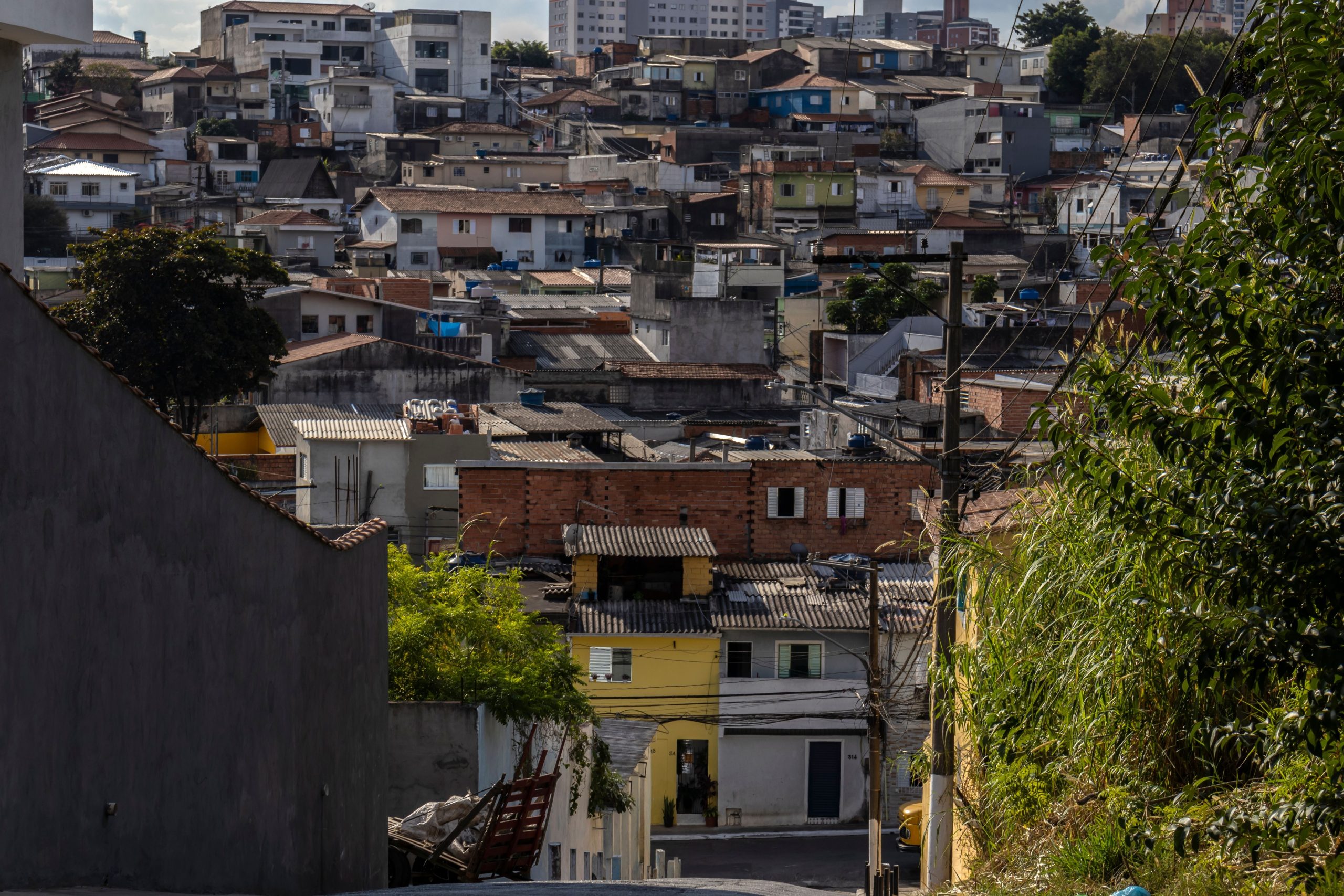 Urbanized slum in Sao Paulo outskirts with densely packed houses.