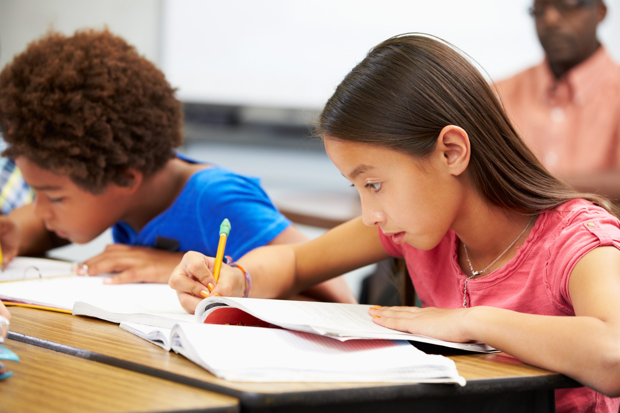 Pupils Studying At Desks In Classroom Represent The Third Of Bruner's Three Modes of Representation